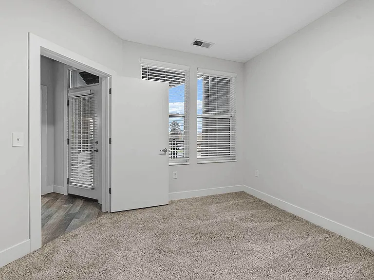 Spacious private balcony with modern railing and wood decking in two-bedroom apartment Columbus OH Spacious private balcony with modern railing and wood decking in two-bedroom apartment Columbus OH