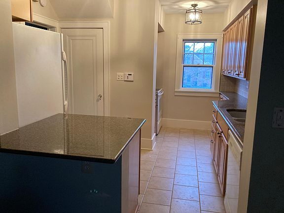 Lots of kitchen cabinetry and a two seater island.