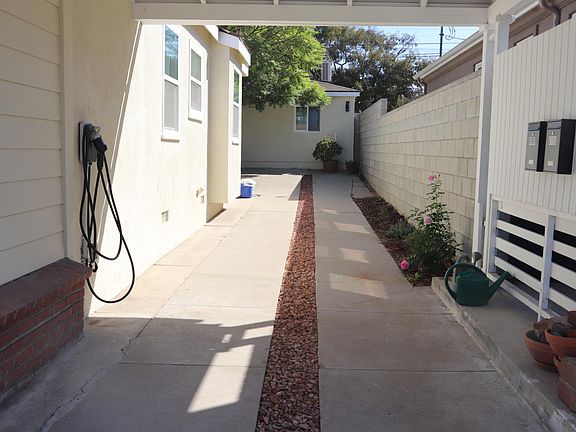 Studio street facing window at end of carport