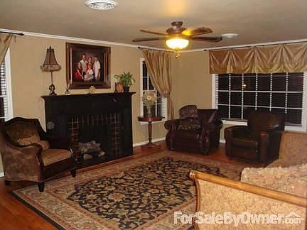 Living Room
						:
						View from Dining room, living room offers a NG burning fireplace.