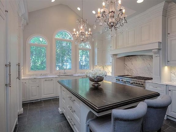 Huge Sueded Negresco granite island! Cabinets, cabinets, cabinets!