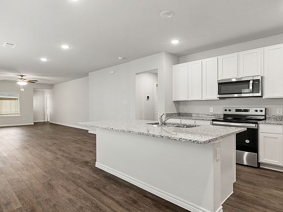 Dining to kitchen and family room