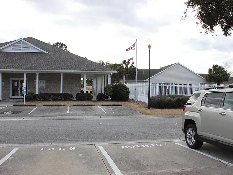 Front porch view of the clubhouse and pool
