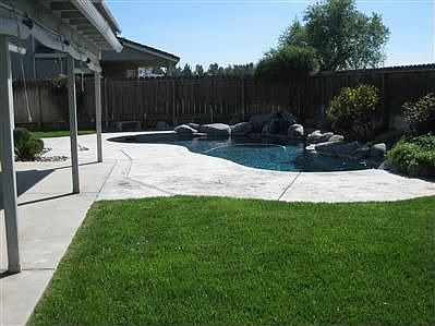 Backyard with sparkling pool.