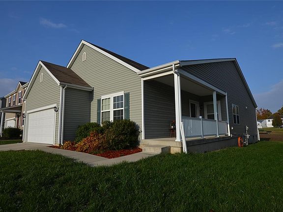 2,000 sq ft awaits inside! Covered front patio is great for evenings to sit and chat with neighbors.