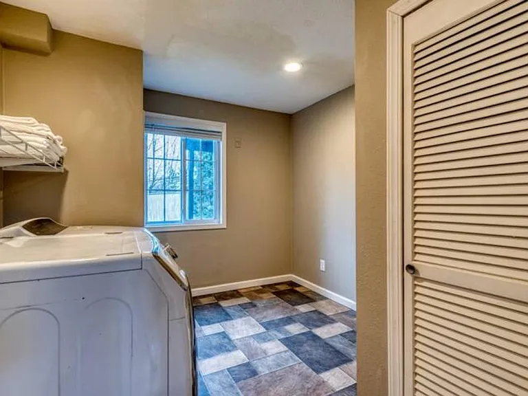 Laundry area perfect for long-term stays. It is on the ground floor and right off the garage door.