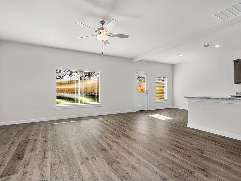 The living room sits right off of the kitchen and dining room.