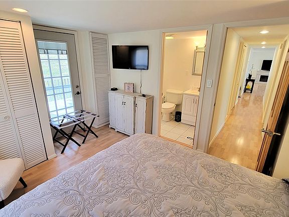 master bedroom with door to large deck