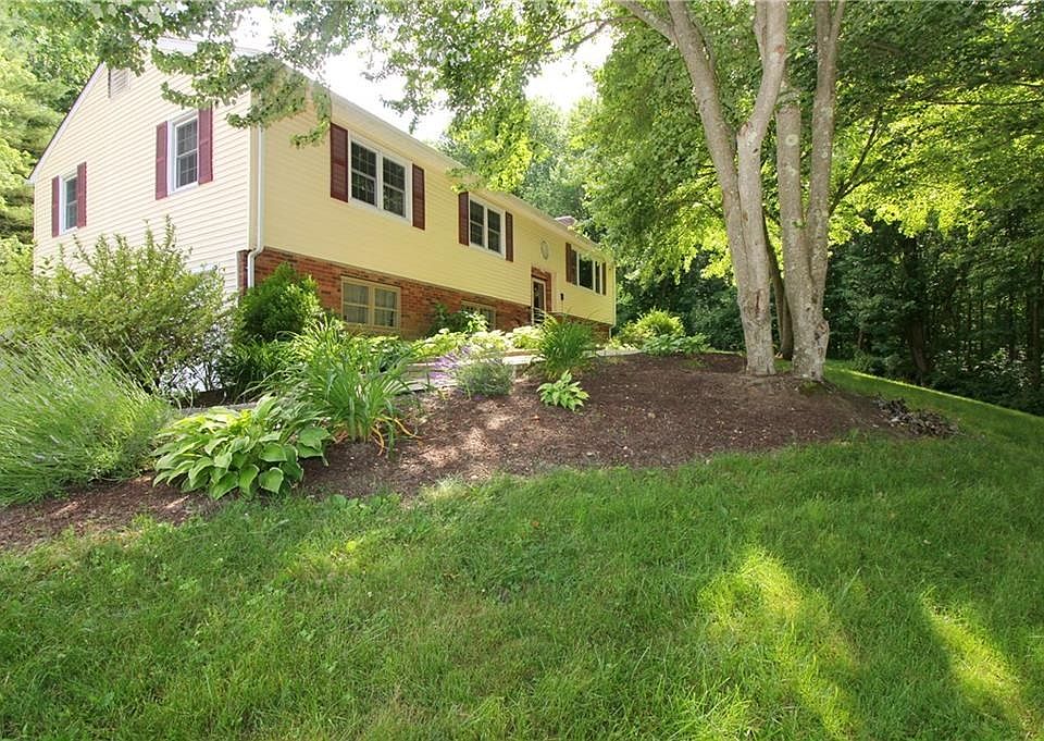 Set a top the hill in shaded privacy sits this wonderful raised ranch waiting for its next family!