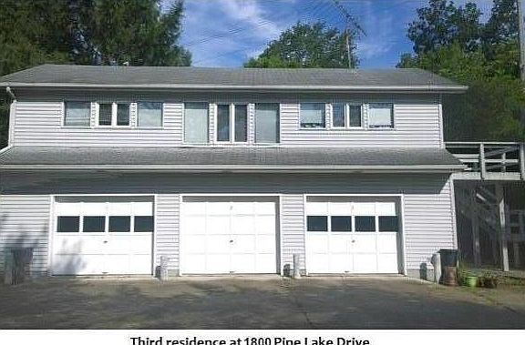 Available unit is upstairs; one garage spot included.