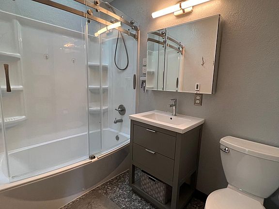 Upstair bath, round sided soaking tub, heated floor, skylight that opens above tub.