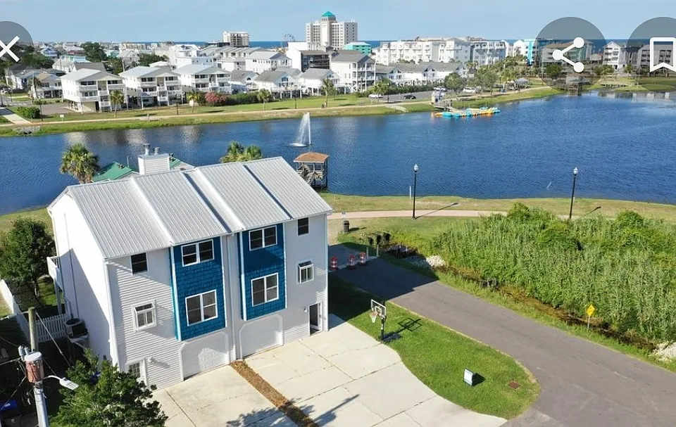 Left side of duplex. Lake front, 3 blocks from Beach. (Driftwood beach access). Fenced yard, metal roof. Room for 3 vehicles in driveway plus garage storage.