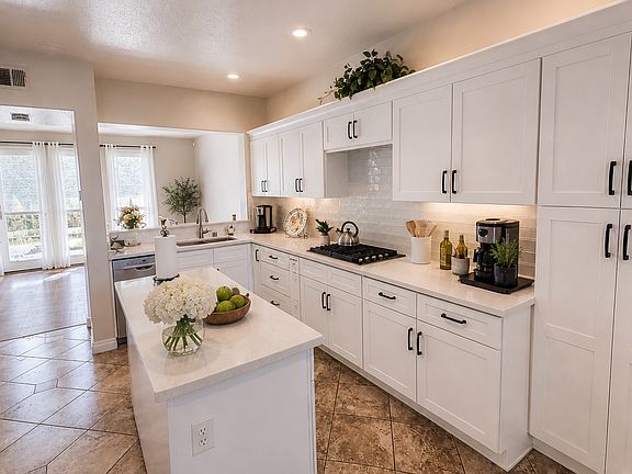Kitchen - Brand new kitchen featuring all-new cabinets, countertops, sink, and appliances including stove, oven, and microwave. Bright and modern with ample storage, this beautifully updated kitchen is perfect for everyday living and entertaining.
