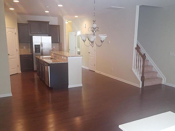 View at the dining area & kitchen from the back/patio door