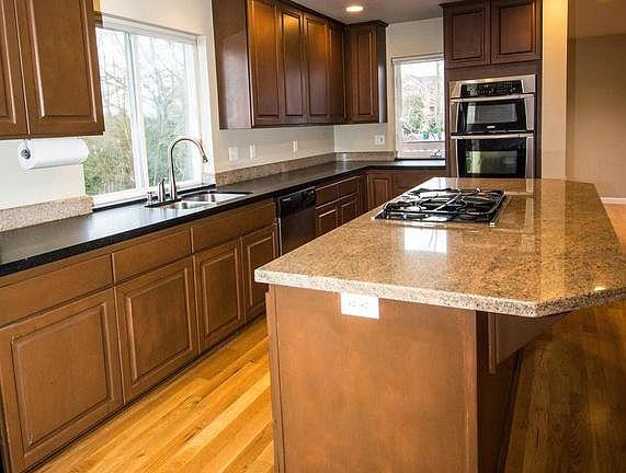 Many cabinets. Gas cooktop with downdraft