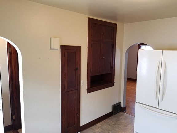 Kitchen area,   pantry and ironing board 