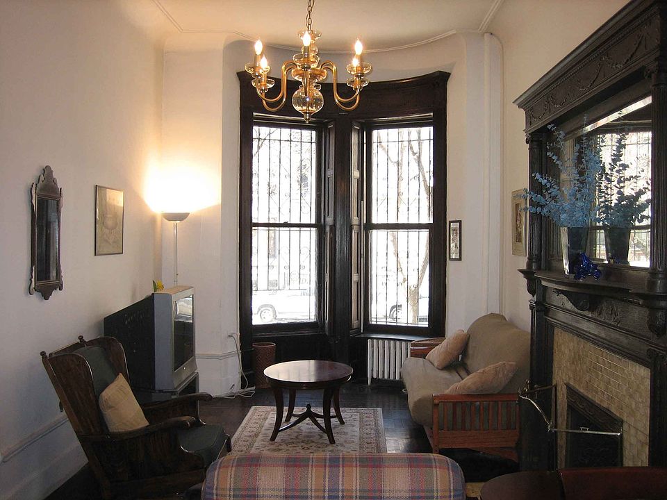 Living room with bay windows and 16' ceilings