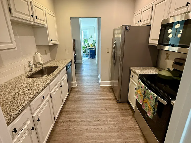 Kitchen walkthrough to dining area