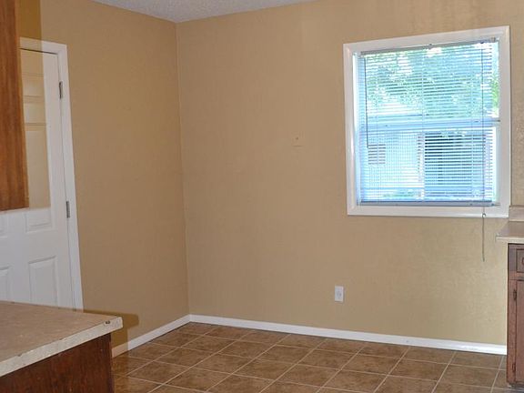 Kitchen has an eat in dining room