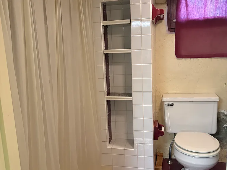 Fully functional second bathroom available in basement. Includes shower, toilet, and laundry sink (not pictured).
