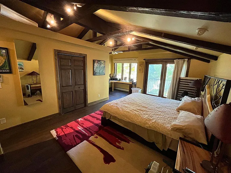Spacious vaulted ceiling master with warm natural light