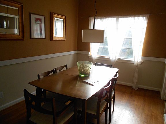 Dining Room with burlap wall paper and chair railing