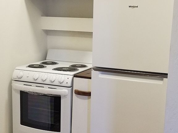 Kitchen featuring new appliances, extra storage pull out cabinet. Upper cabinets. New hardware.