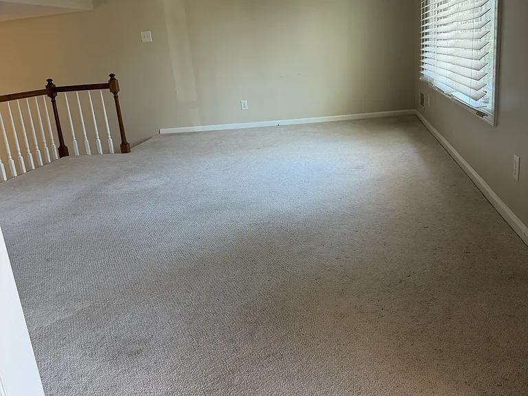 LR - view from foyer with stairs down to Dining room / Home office.