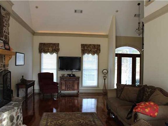 Stone wood burning fireplace in family room.