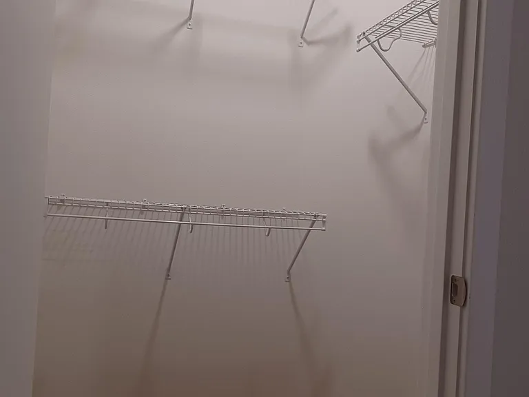 Walk-in closet in bedroom
