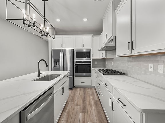 This move-in ready home features gorgeous quartz countertops in the kitchen