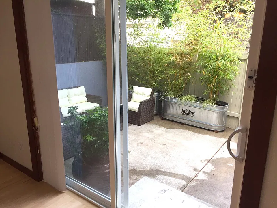 Patio off living room. Currently it has astro-turf but the turf could be removed if tenant prefers concrete.