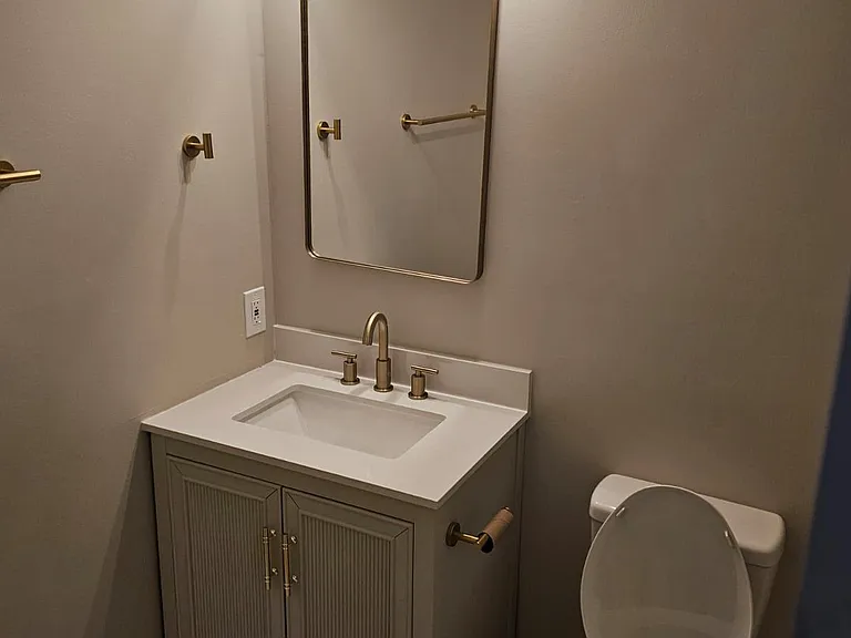 Upstairs shared vanity/toilet