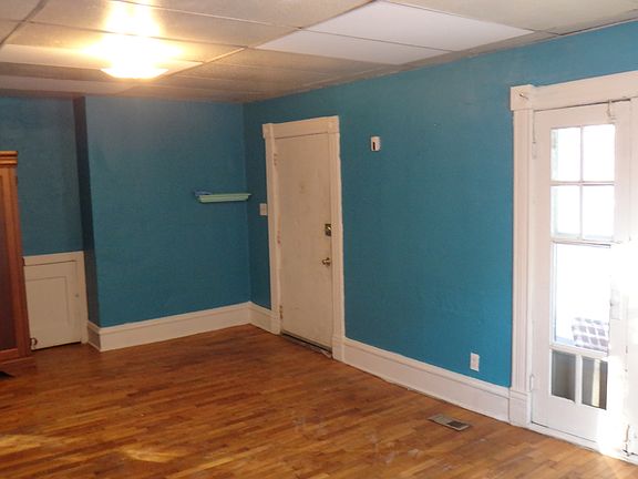 Living room, french doors beautiful, entertainment cabinet- included!
