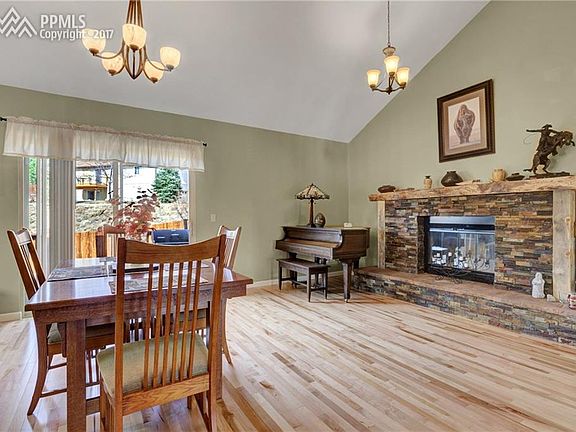 The dining room has a custom wood fireplace with slate stone and reclaimed wood!