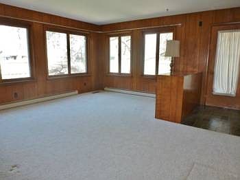 Added on when the kids came along, this family room also has many windows to let in lots of natural lighting with views of the backyard garden beds!