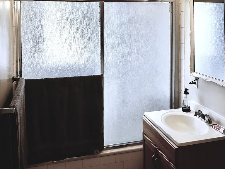BATHROOM, TUB AND SHOWER