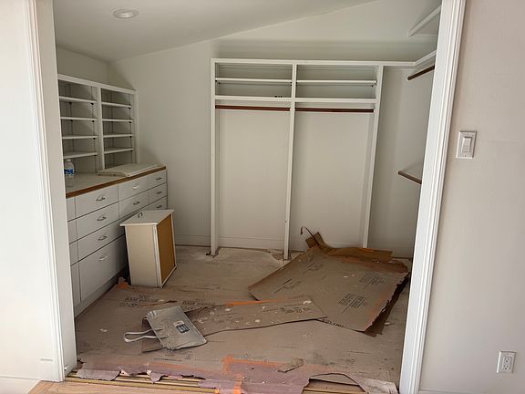 Primary Walk-In Closet with Mirror Sliding Doors