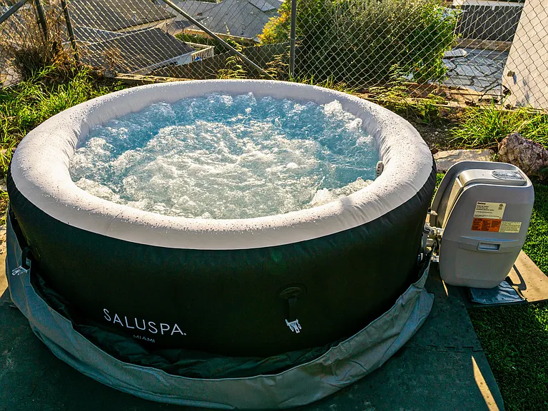 Unwind in a soothing hot tub for the ultimate spa experience at home!