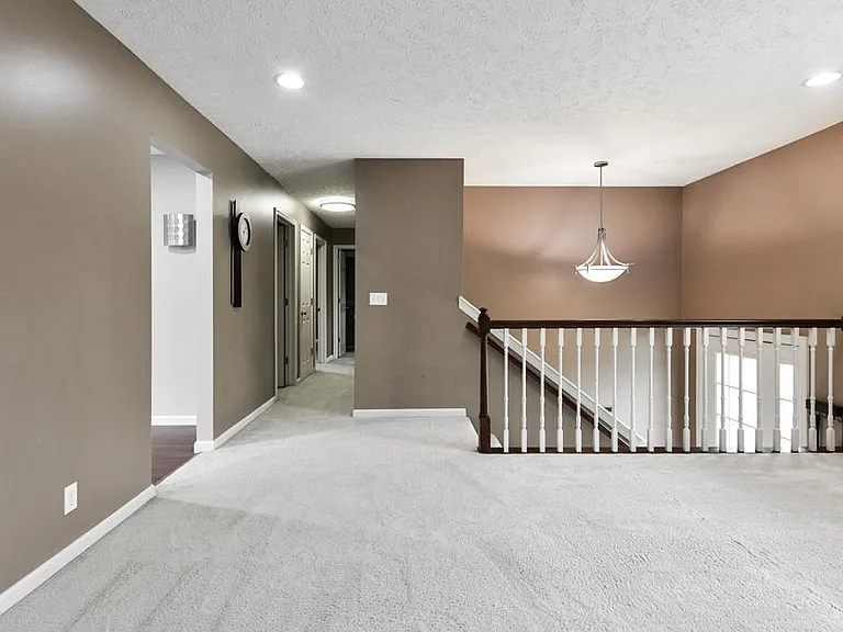Entry Stairs to Living, Family Rooms and Hallway to Bedrooms