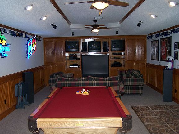 600 sq ft game room with surround sound and  wall to wall entertainment center