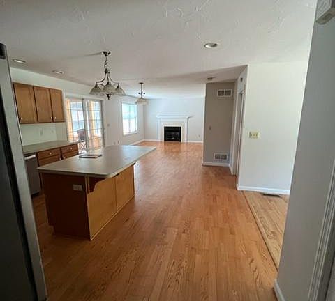 view of kitchen and dining from the side entry/garage entry