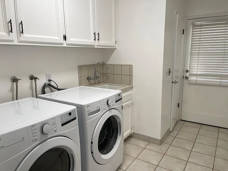 New Washer and dryer, door have access to the pool area and rear patio.