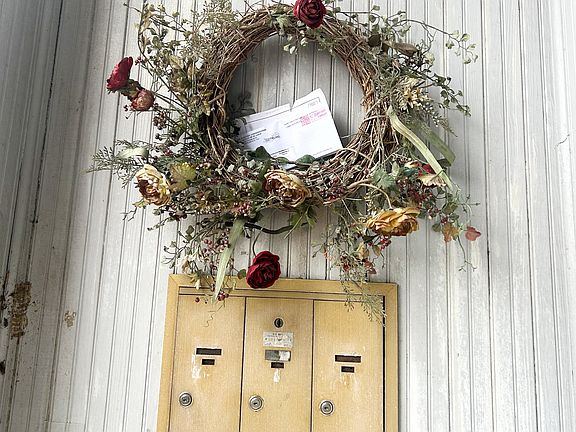Upon the front porch, youll find locked mailboxes to the left of the front doors.