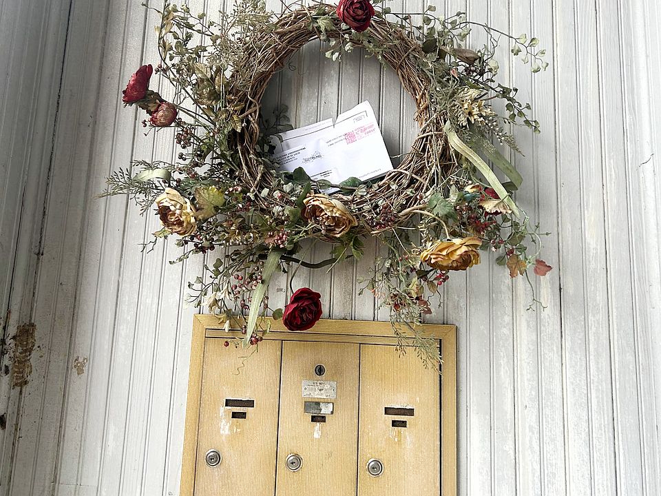 Upon the front porch, youll find locked mailboxes to the left of the front doors.