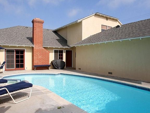 Backyard pool and patio perfect for outdoor fun.