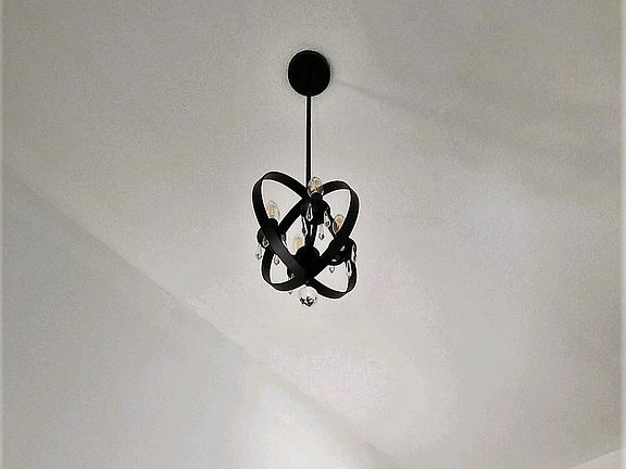 2-story Foyer: New iron and crystal chandelier.