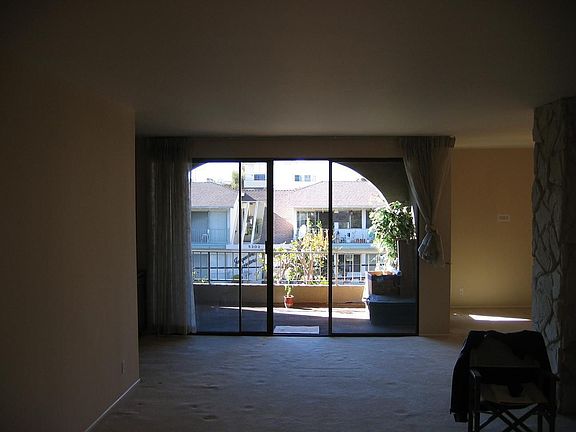 Direct access from the living room to the huge private, covered balcony/patio