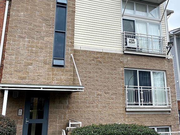 Entry door & outside view. Condo is on the two upper floors.