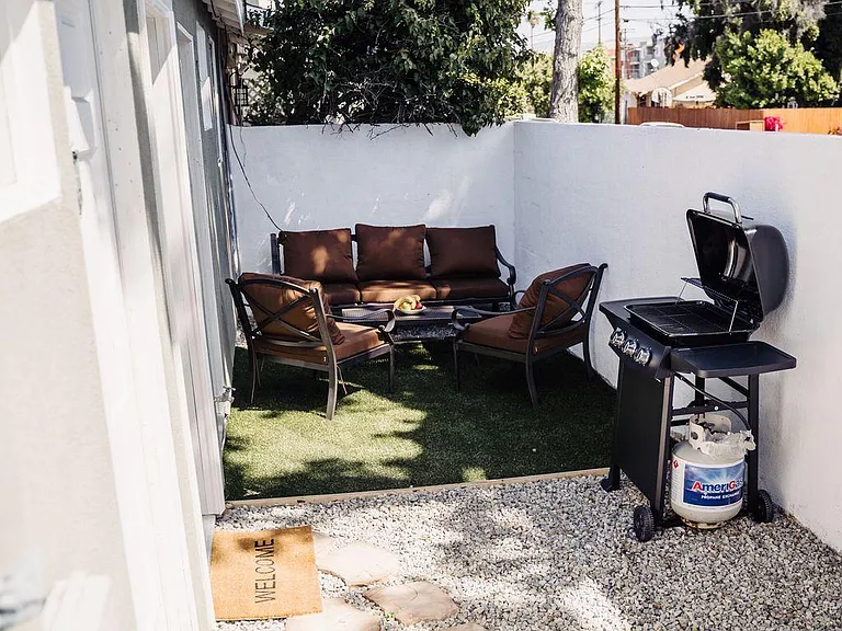 PRIVATE FENCED PATIO WITH BBQ GRILL & OUTDOOR SEATING/FURNITURE